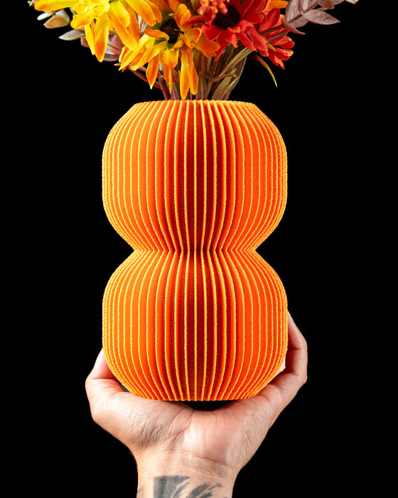 Nolla double-globe ribbed vase with flowers, hand-held view