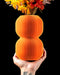 Nolla double-globe ribbed vase with flowers, hand-held view