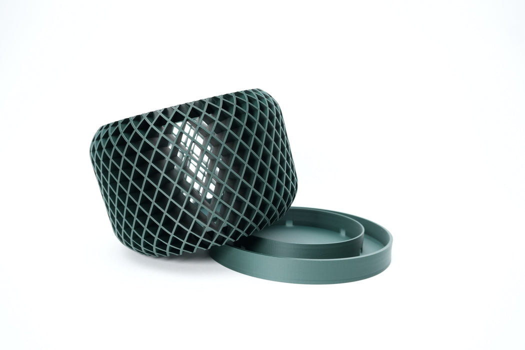Ravik orchid pot shown on its side with removable saucer and open ventilation pattern