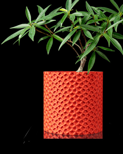 Ordan cylindrical textured plant pot styled with greenery