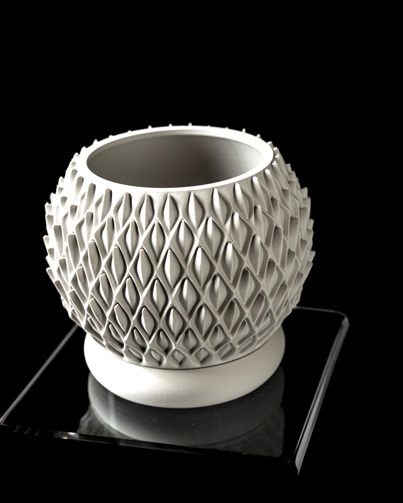 Petal round planter angled view showing opening and repeating diamond-petal texture