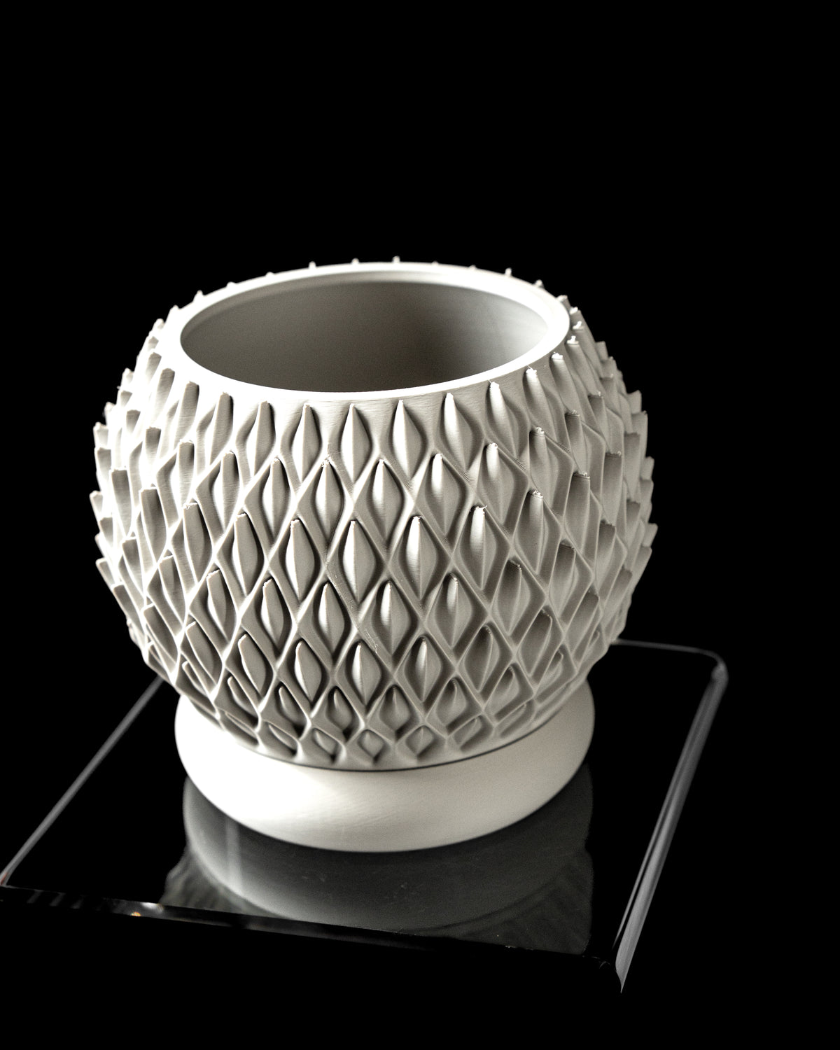 Petal round planter angled view showing opening and repeating diamond-petal texture