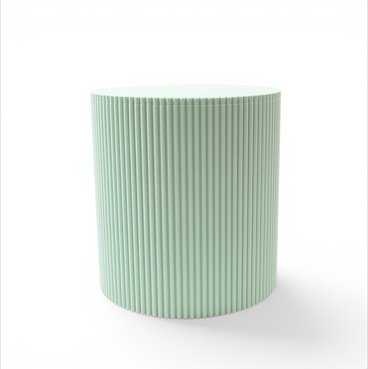 Front view of Tero plant stand in light green showing cylindrical shape and fluted vertical texture