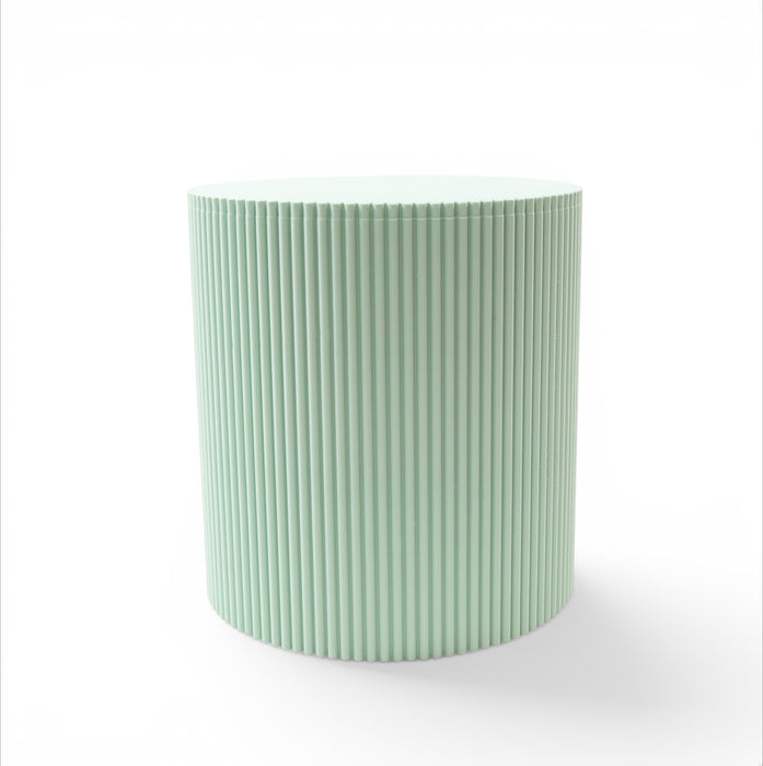 Front view of Tero plant stand in light green showing cylindrical shape and fluted vertical texture