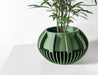 Artistic 3D printed planter pot with elegant geometric design, modern decorative flower pot ideal for succulents, stylish pot with detailed sculptural lines and drainage hole
