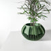 Designer geometric planter pot, 3D printed decorative succulent pot featuring modern vertical ribbing texture, artistic tabletop flower pot with drainage for contemporary decor"