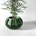 Modern artistic planter pot, 3D printed geometric succulent pot featuring sculptural ribbed surface, decorative tabletop flower pot with stylish textured detail and drainage hole