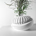 Side view of oval tilted modern planter pot with unique layered texture, stylish sculptural planter, contemporary 3D printed pot for indoor plants and succulents