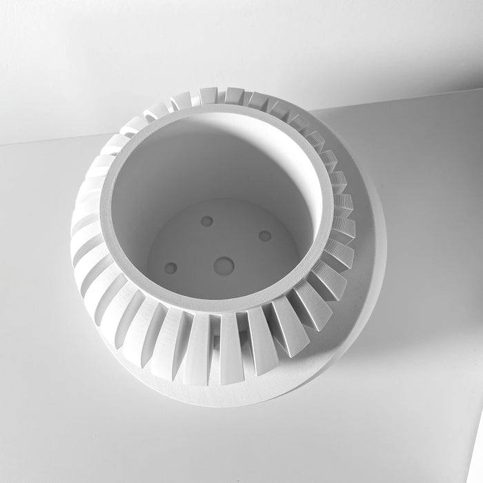 Close-up top view showing drainage holes inside oval layered 3D printed planter pot, functional stylish planter pot with drainage, artistic planter for succulents