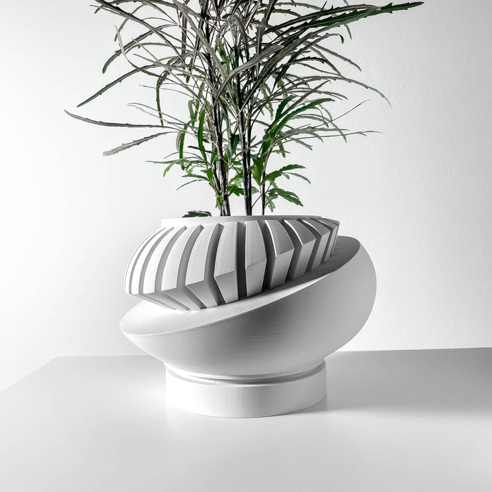 Angled side view of sculptural oval planter pot featuring a geometric layered texture, contemporary tabletop 3D printed flower pot for small plants, elegant decorative planter for indoor use