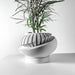 Angled side view of sculptural oval planter pot featuring a geometric layered texture, contemporary tabletop 3D printed flower pot for small plants, elegant decorative planter for indoor use