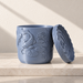 Blue Coraline fish-relief planter beside its matching scalloped tray, shown upright on a light surface.