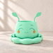 Empty mint Pika planter with leaf-shaped ears, a smiling face and a matching rounded tray.
