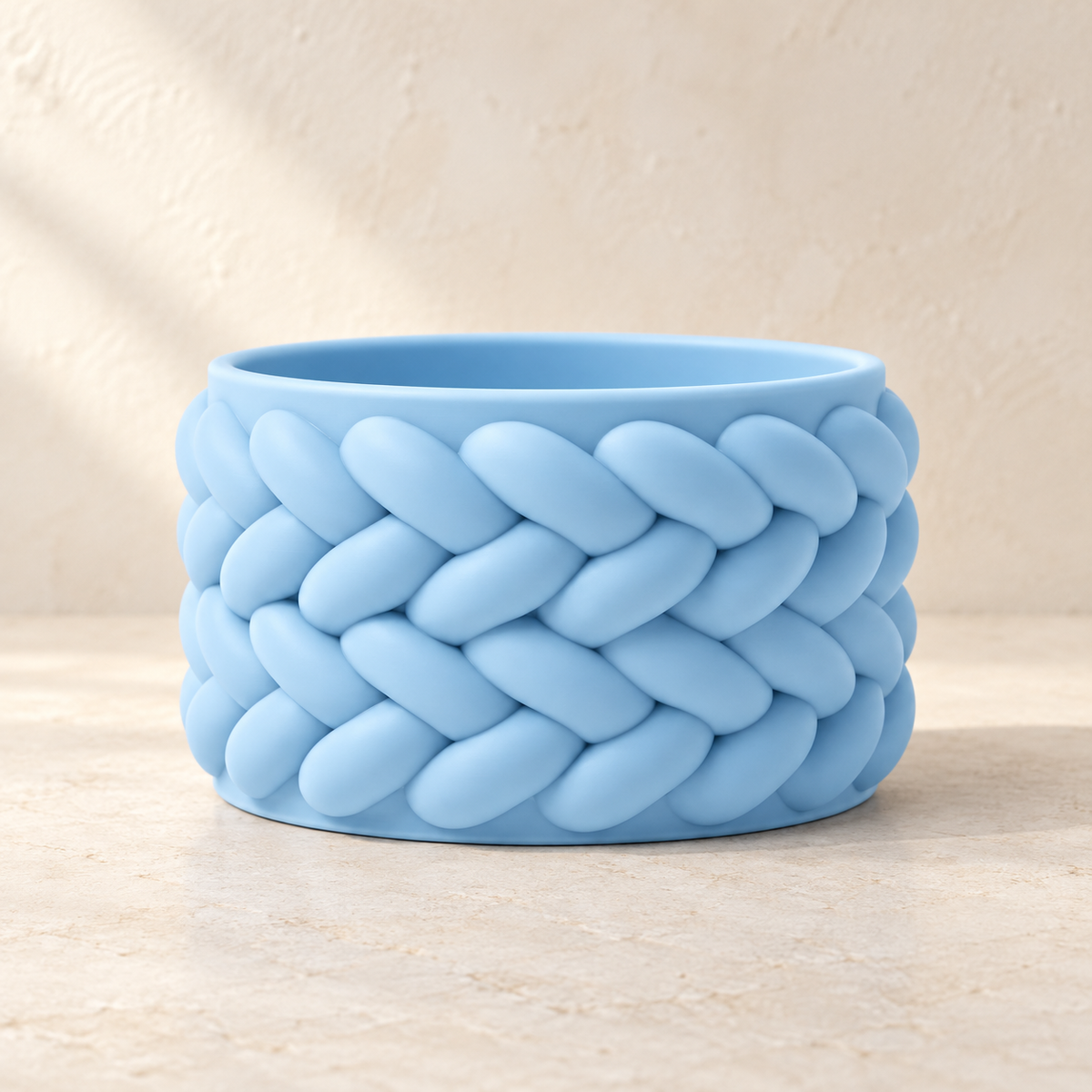 Braido woven planter showing soft braid-like overlapping texture across the design
