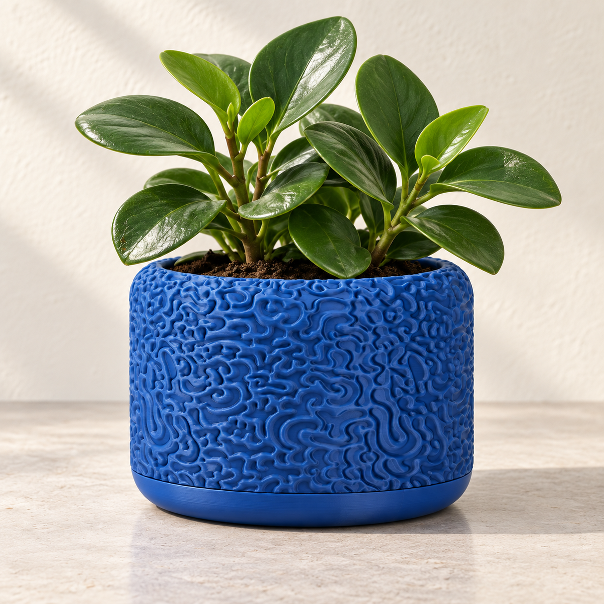 Drift indoor planter with flowing layered surface texture
