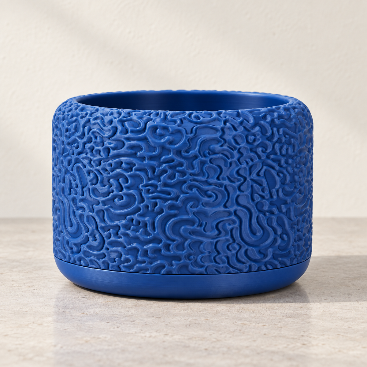 Drift indoor planter showing flowing layered surface texture across the design