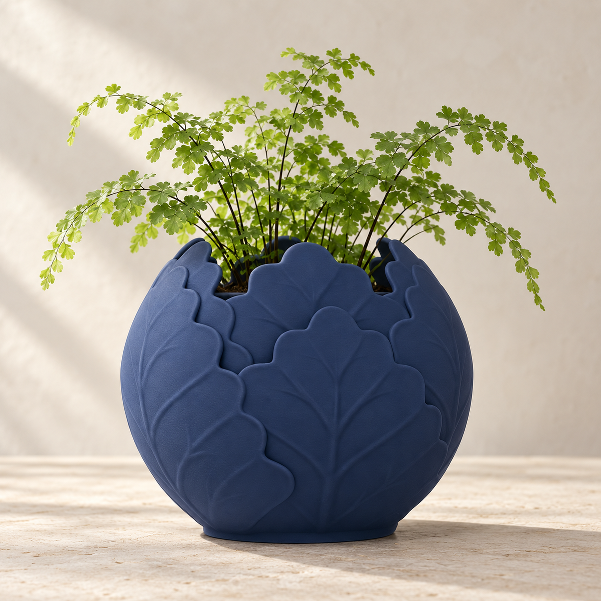 Folira round planter with layered leaf relief with raised vein detail