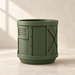 Front view of industrial indoor planter with framed mechanical panel design