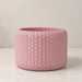 Pelta sculptural planter showing ordered overlapping scale texture across the design