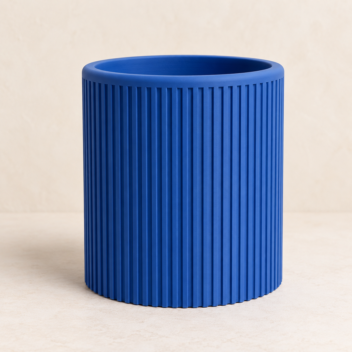 Sano indoor planter showing continuous vertical ribbed texture across the design
