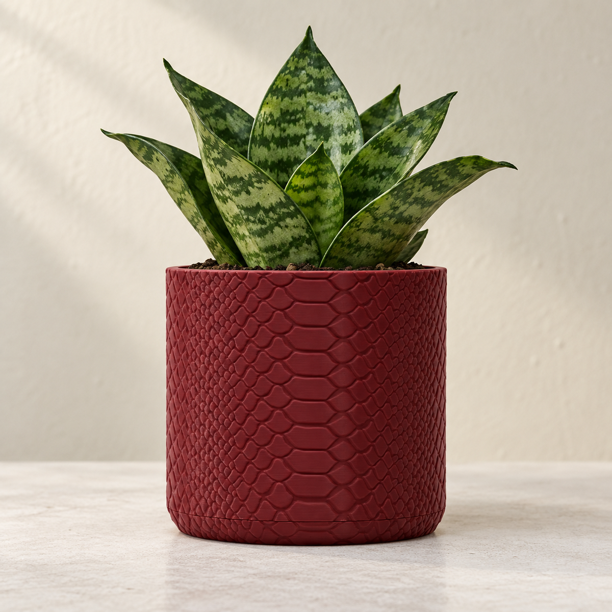 Serpen indoor planter with subtle snake-scale texture