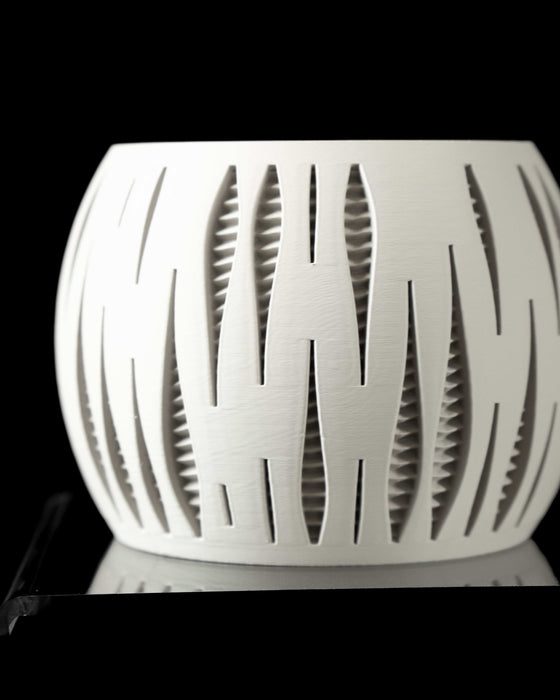 modern white 3D printed pot with vertical architectural slits revealing textured inner walls, clean minimal surface, round silhouette, set on custom matching tray, planter for succulents or small trees, ideal for creative decor settings, functional art object
