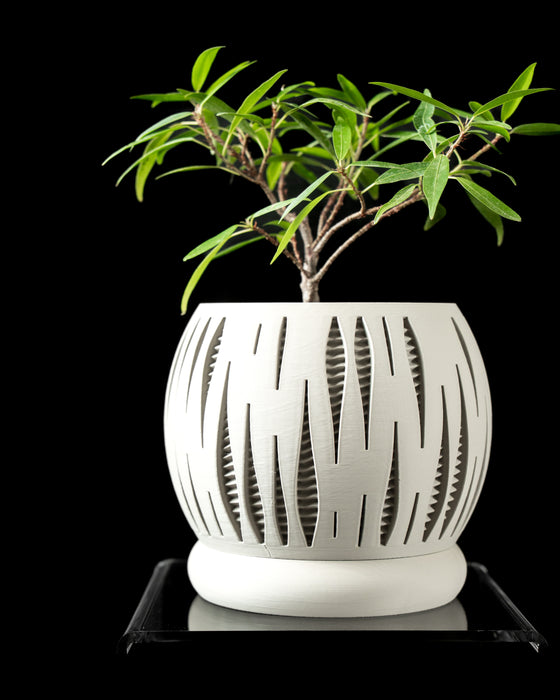 closeup of spherical 3D printed planter with alternating vertical cuts and internal ribbed mesh, smooth matte surface, displayed on black background, designer pot for modern spaces, white flower pot, housewarming gift, sculptural planter, light passing through cutouts, one-of-a-kind decorative container