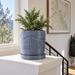 Timberline indoor planter styled to show sculpted woodgrain-style surface
