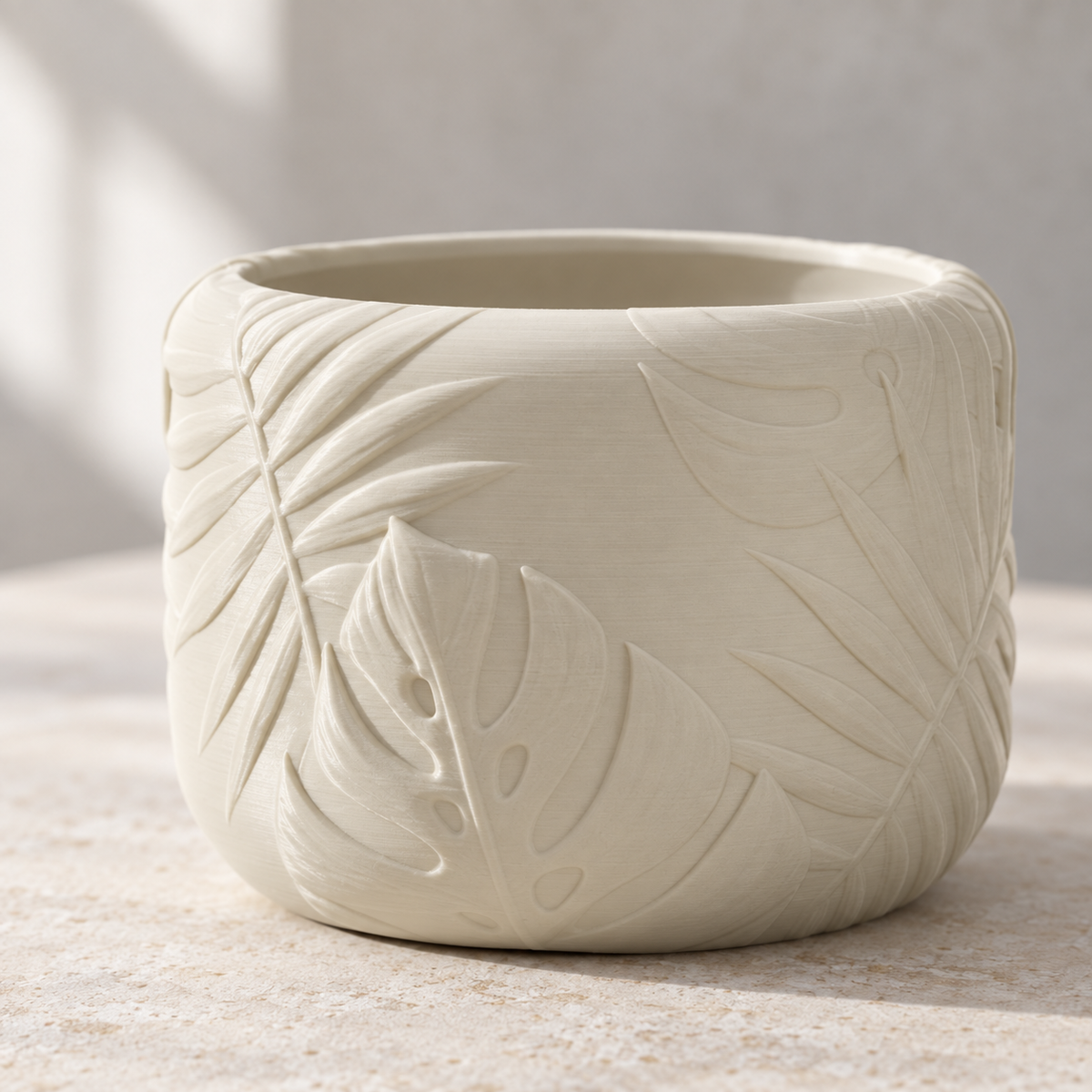 Back view of Tropica round planter showing the continuous botanical leaf texture
