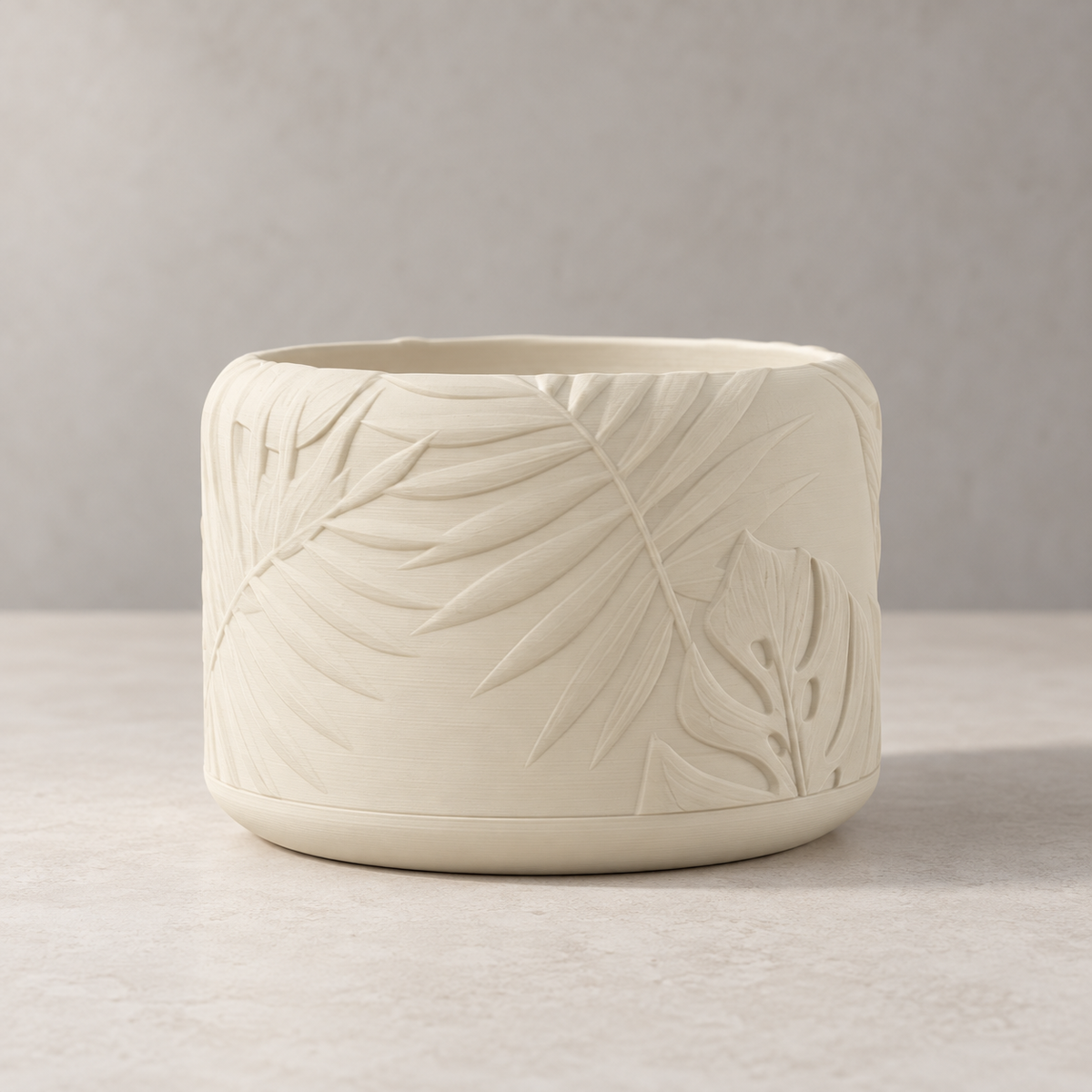 Tropica leaf planter shown with its textured tropical relief and rounded cylindrical shape