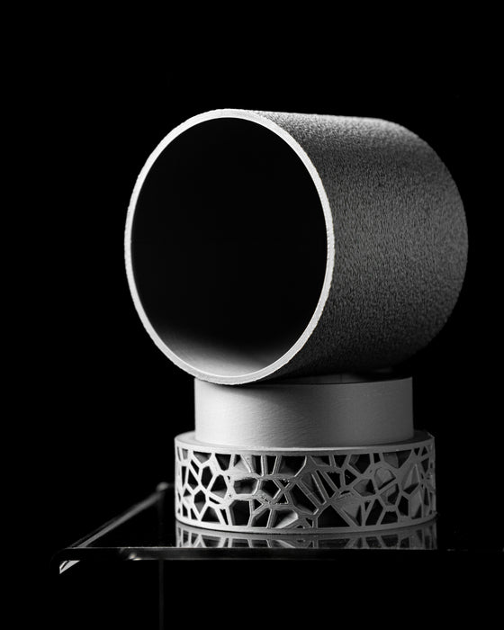 top-down perspective on a minimalist planter pot with structured grain and precision geometry, revealing a seamless interior and stable rim, resting on a cellular-style base, expertly 3D-printed to merge sustainability and beauty, matte grey tone matches industrial or modern homes, perfect for tabletop or windowsill placement, large planter, 3d printed planter, housewarming gift, planters and pots, personalised gifts, new home gift, flower pots, minimalist design lovers, tech-inspired home item