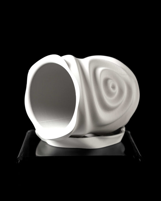 angled view of white cylindrical planter with soft ripple design and gentle folds, paired with matching drainage tray, organic form sculpted by simulated water vibration, plant with green leaves emerging from top, matte surface highlights layers of 3d print, functional and decorative, clean modern design suitable for tabletop or windowsill display, visually calm and fluid