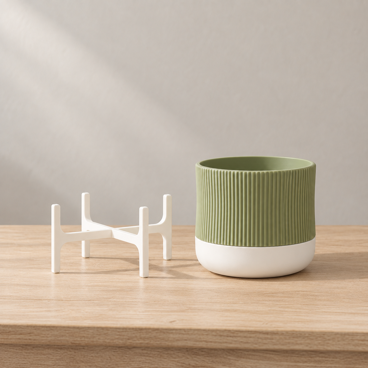 Green Rialto planter in its white lower bowl beside the detached white supporting frame.