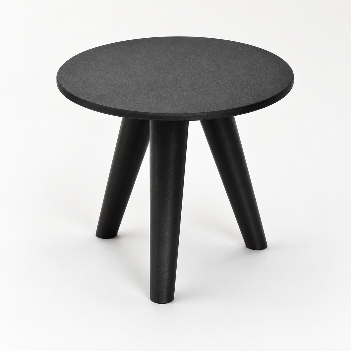 Black Orbitri tripod plant stand viewed from above, showing its round solid top and three angled legs.