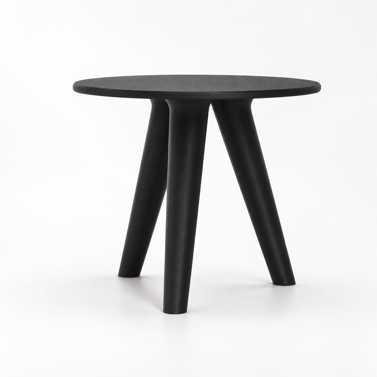Side view of the empty black Orbitri plant stand with a thin round top and three splayed legs.