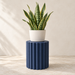 Pillar round plant stand styled to show continuous fluted pedestal lines