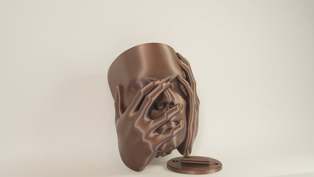 Echo wall planter video showing sculptural face planter and wall mounting piece from different angles