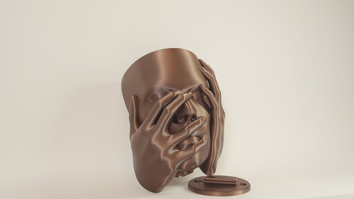 Echo wall planter video showing sculptural face planter and wall mounting piece from different angles