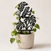 Rana frog plant trellis in a cream planter supporting a climbing pothos vine
