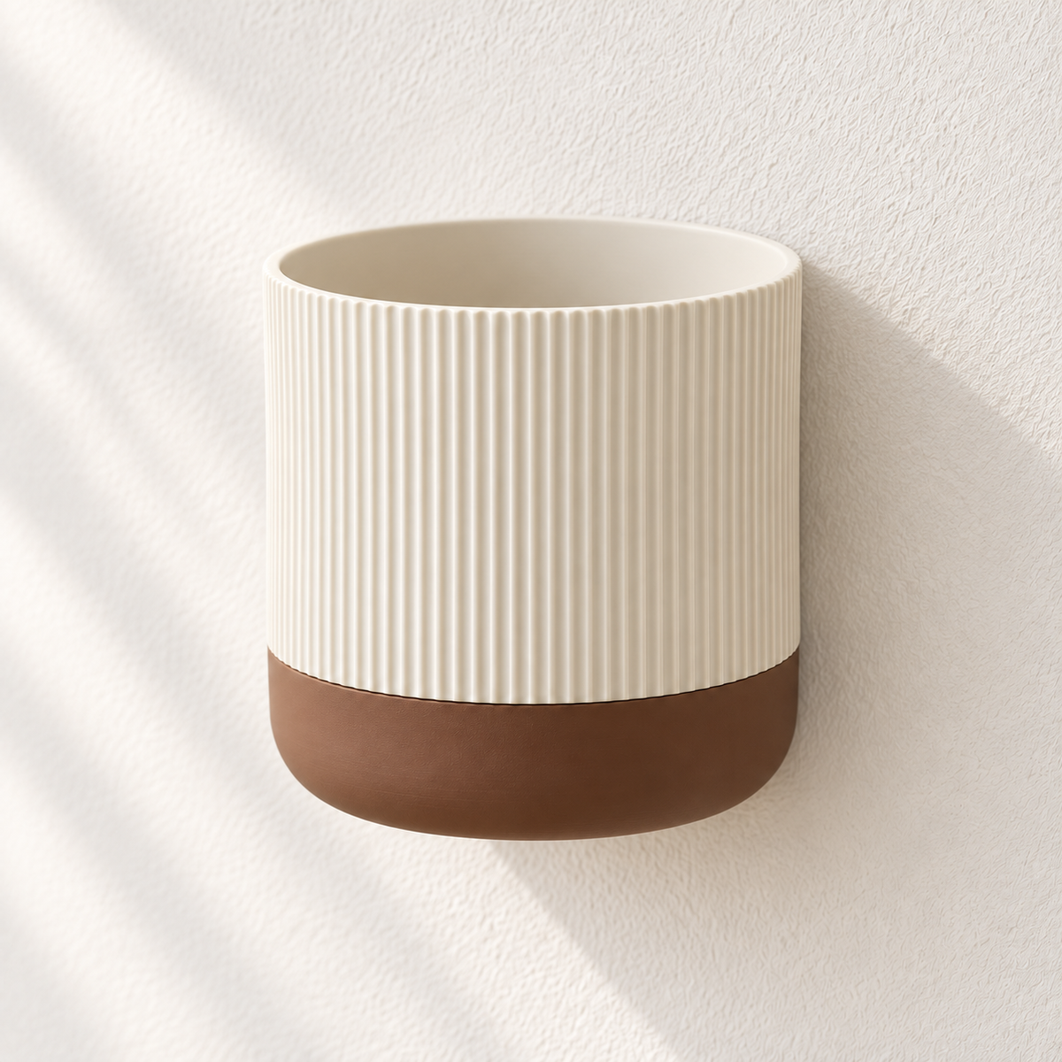 Cream Rialto wall planter with fine vertical ribs above a contrasting brown lower section.