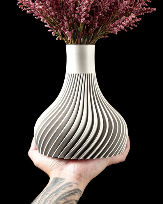 overhead angle of ribbed vase for flowers, 3d printed minimalist vase with inward curving neck and smooth white finish, flower vase for dried flowers and stems, sculptural modern vase, vases for flowers, home office decor, modern home accent