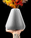 Rillan pear-shaped ribbed vase with broad lower body and narrow opening