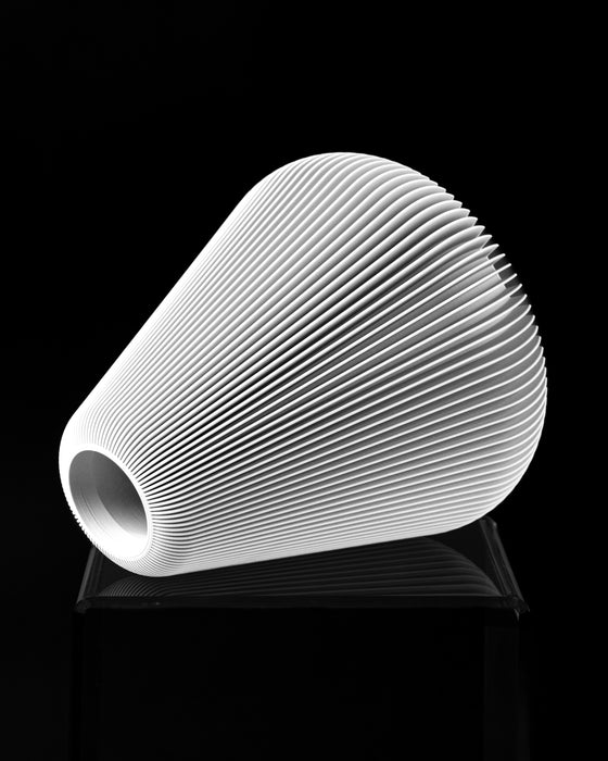Side view of Rillan flower vase with small top opening and vertical ribs