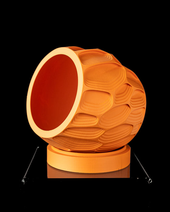 Ringo planter angled view showing round opening and organic layered relief