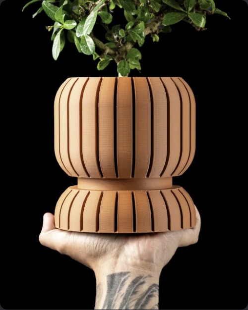 Riven ribbed pedestal planter with rounded fluted body and matching sculptural base
