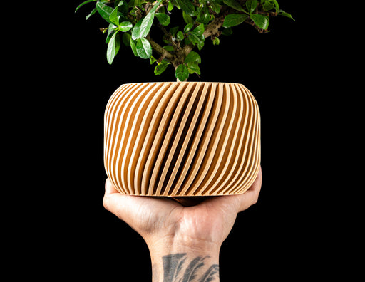 Rivo round indoor planter with fine diagonal ribbed texture
