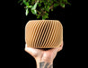 Rivo round indoor planter with fine diagonal ribbed texture