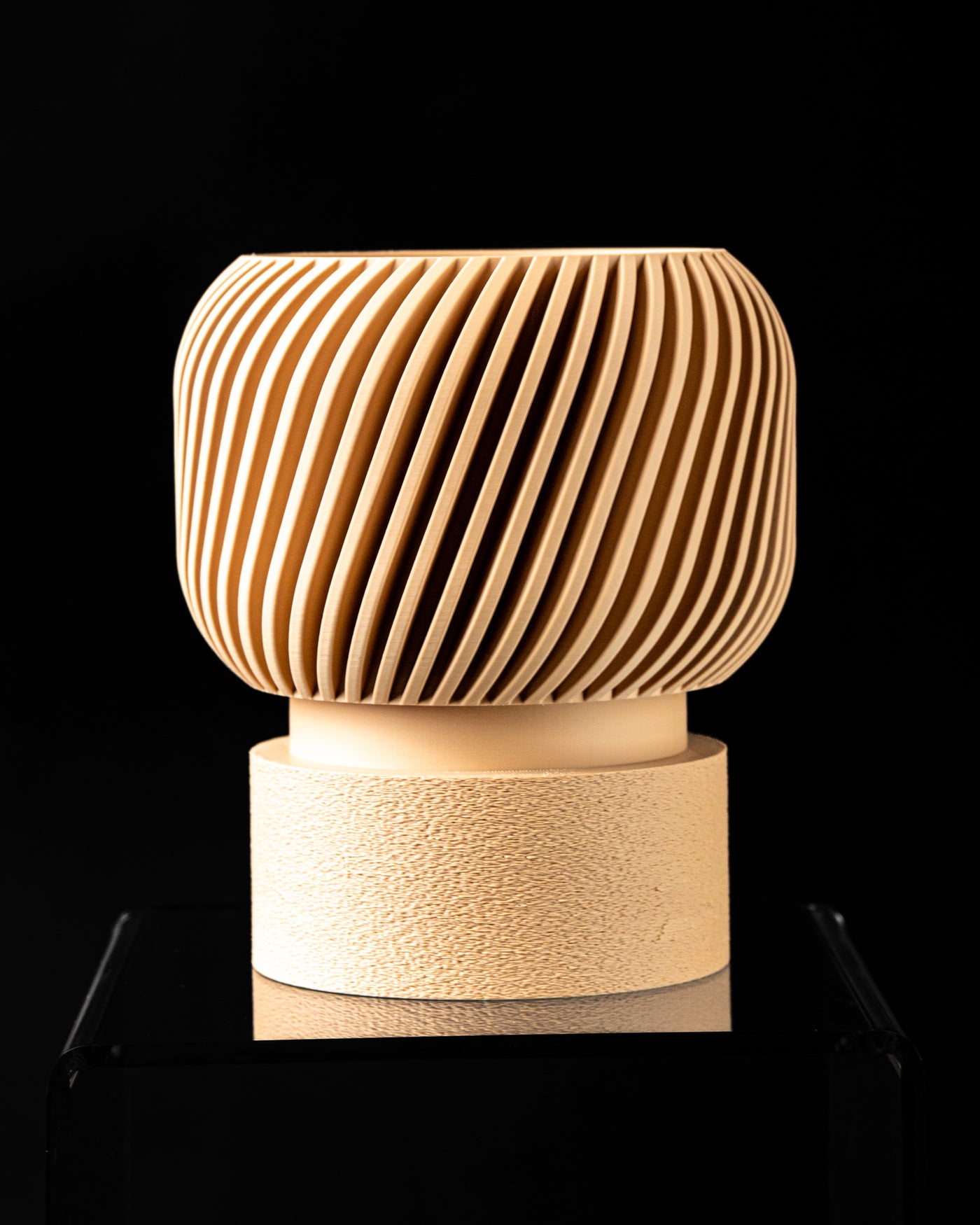 Angled view of Rivo indoor planter with diagonal fluted surface