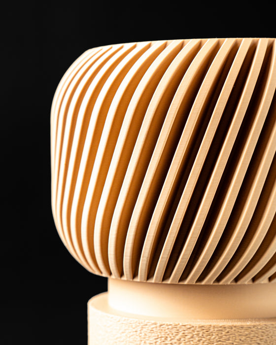 Close view of Rivo round planter and fine ribbed wall texture
