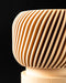 Close view of Rivo round planter and fine ribbed wall texture